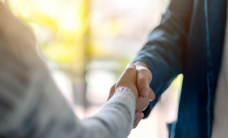 two people shaking hands